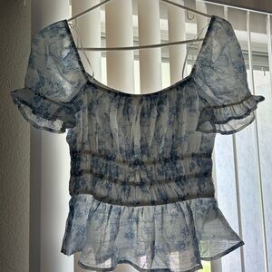 Floral white and blue top.